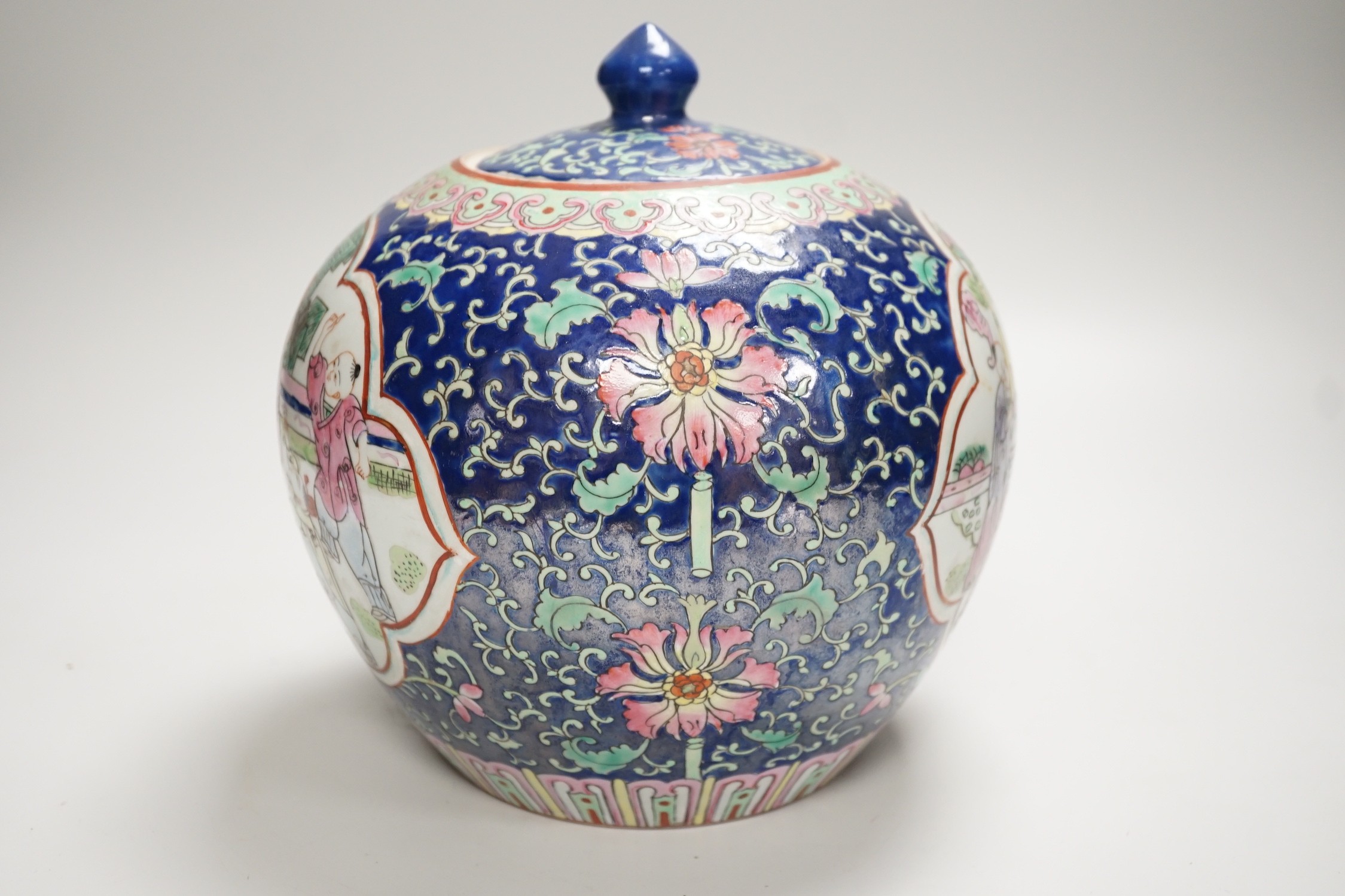 A Chinese famille rose jar and cover, 20cm high